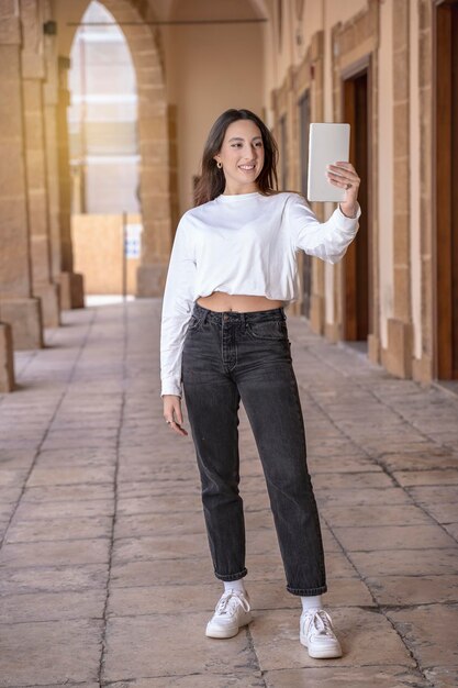 Candid Asian Girl in Jeans and White Converse